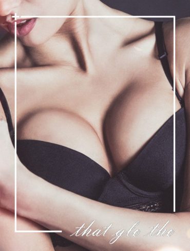 A woman is posing in a black bra with the text that girl.