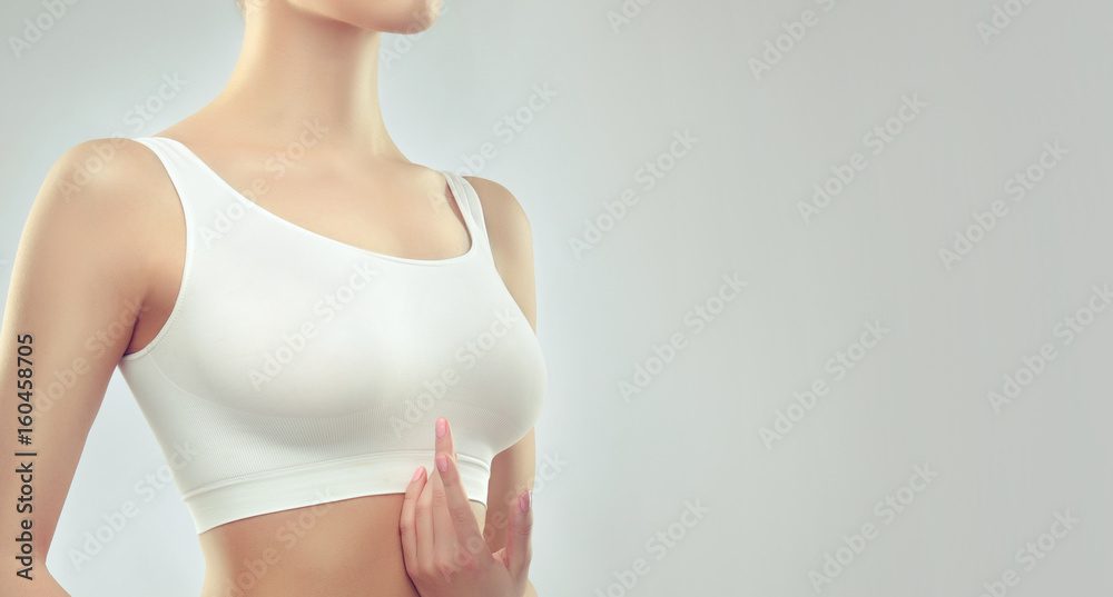 a woman in a white sports bra