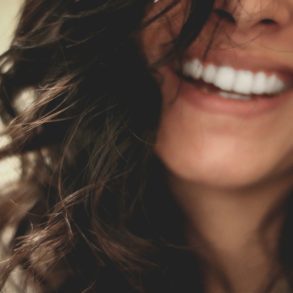 A close up of a woman smiling.