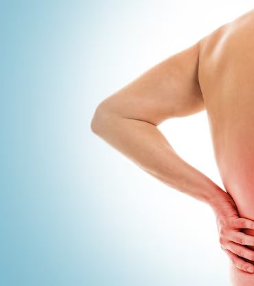 Man holding lower back in pain